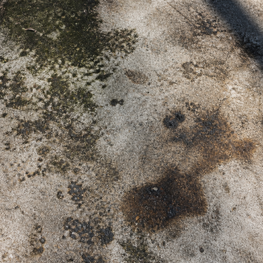 High Pressure Cleaning Melbourne: When & Why It Works Concrete driveway with visible dirt, mould, and oil stains