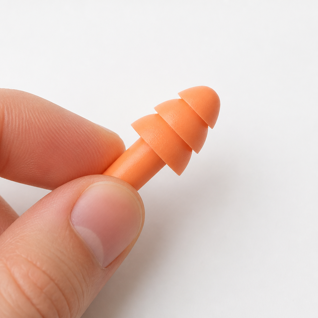 Close-up of an earplug displayed to show proper insertion technique
