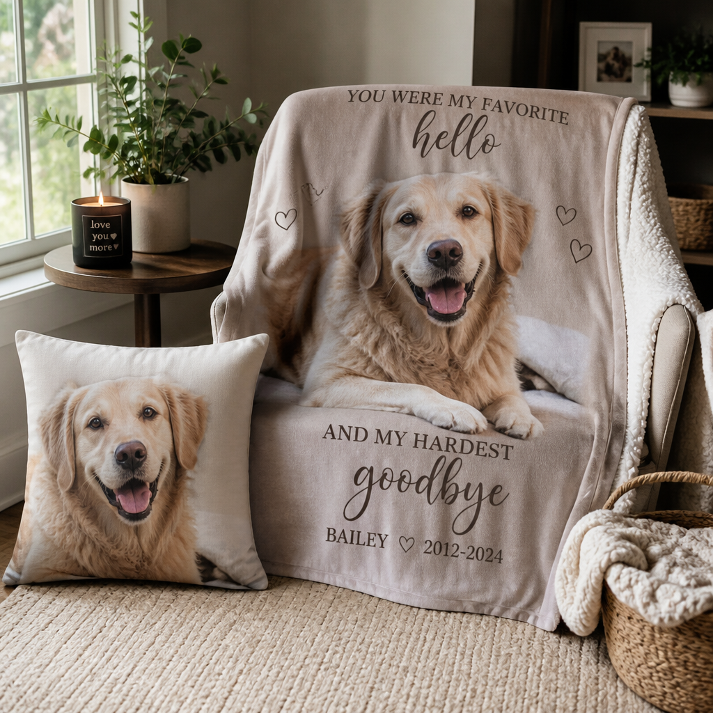 A personalized pet memorial blanket and pillow arranged on a chair near a window
