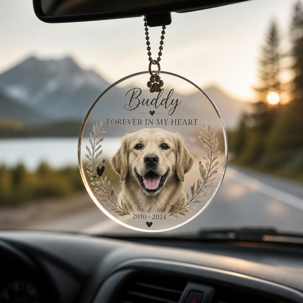 Personalized pet memorial car ornament hanging from interior mirror with pet portrait and outdoor scenery in background