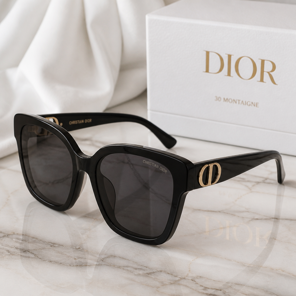Close-up of Dior 30Montaigne sunglasses on marble surface, highlighting luxury Italian craftsmanship