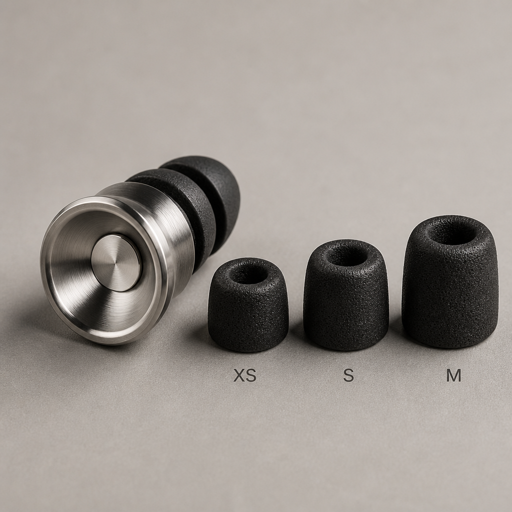 Close-up of metal earplug with three sizes of soft memory foam tips showing customizable fit options
