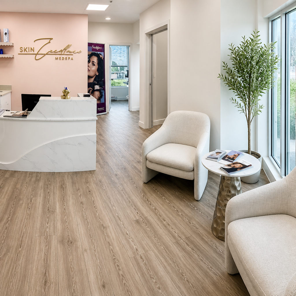 Waiting lounge at a medspa with treatment guides on a side table, ready for a combination consultation